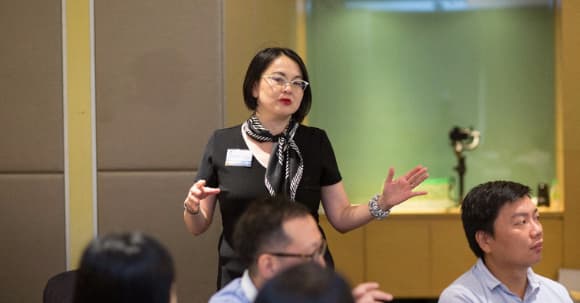 Evelyn Foong presenting to colleagues
