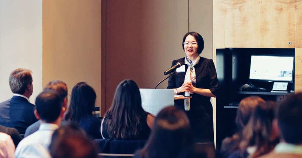 Evelyn Foong speaking at a Zurich event